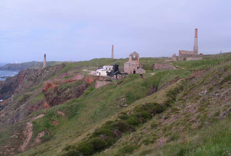 <br>Levant Mine from the south showing the leat in the foreground, left to right the calciner, stamps and compressor stacks and the whim and pumping engine houses in the centre with the Skip Shaft headframe., Penwith Local History Group