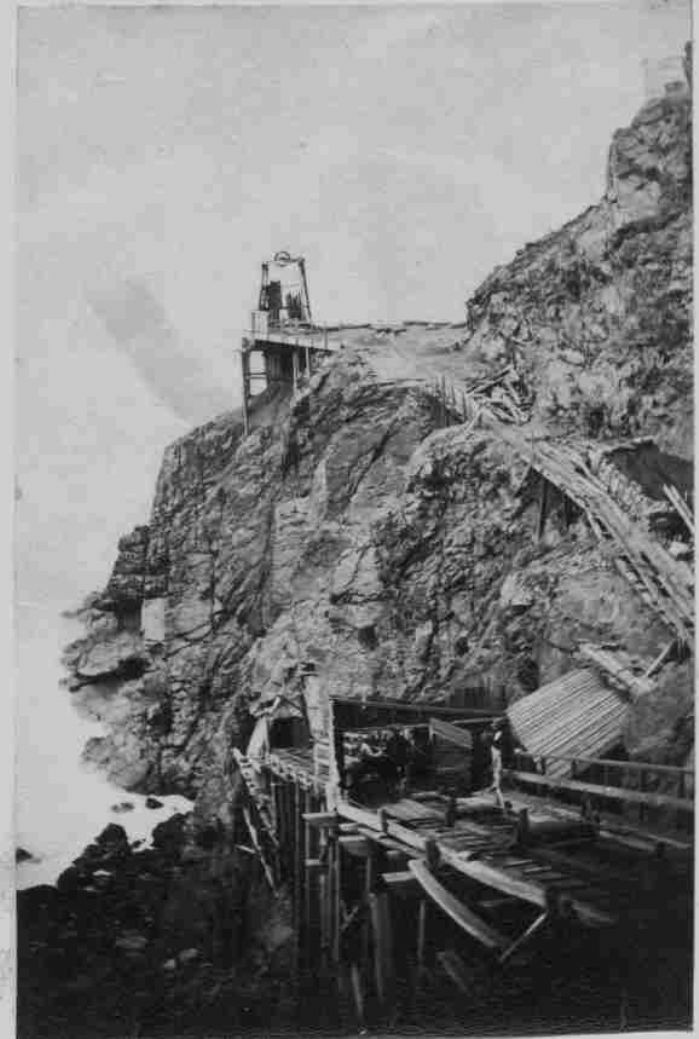 An early picture of the incline going down into the Crowns Mine, possibly while the trestle was being completed in 1862. This the route most of the visitors took into the mine until the Crowns was abandoned in 1874. Also shown is Wheal Button headframe. (photo Malcolm McCarthy Collection)